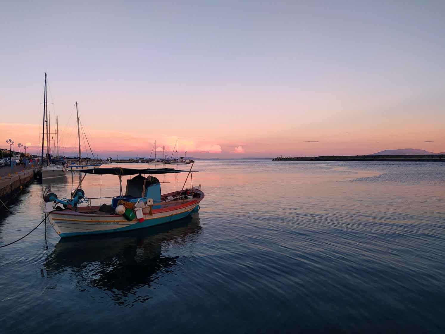 The port of Plomari during sunset. Visit Plomari, Lesvos.